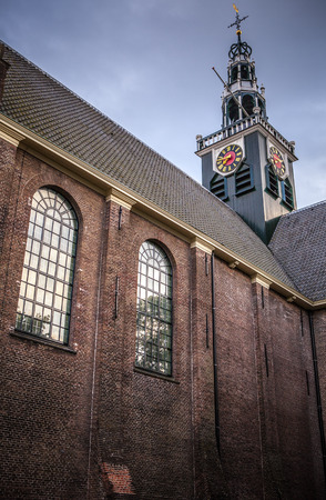 ZAANDAM, NETHERLANDS - JUNE 13, 2016: General landscape views in traditional church architecture of Zaan region at twilight on 13 June in Zaandam, Holland.のeditorial素材