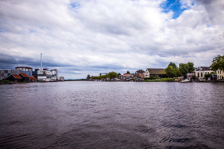 AMSTERDAM, NETHERLANDS - AUGUST 14, 2016: Famous Industrial buildings of Amsterdam city close-up. General landscape view of city building and traditional Dutch architecture. Amsterdam - Netherlands.のeditorial素材