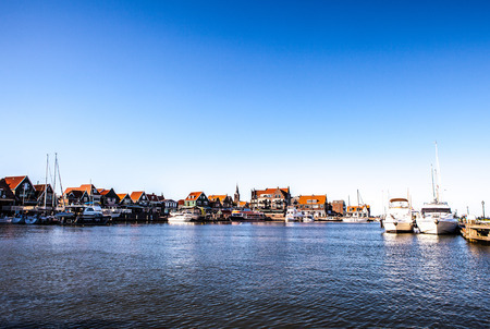VOLENDAM, NETHERLANDS - JUNE 18, 2014: Boats and sail boats in Volendam Harbor. Volendam - a small town that has preserved the tradition of Dutch fishing villages.のeditorial素材