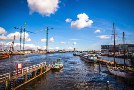 AMSTERDAM, NETHERLANDS - AUGUST 15, 2016: Mooring with a set of private boats in Amsterdam. General...