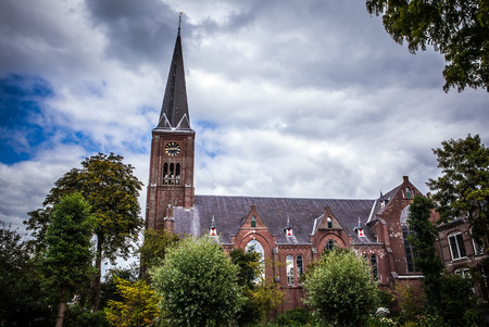 ZAANDAM, NETHERLANDS - JUNE 13, 2016: General landscape views in traditional church architecture of Zaan region at twilight on 13 June in Zaandam, Holland.のeditorial素材