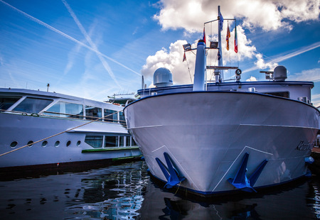 NETHERLANDS, AMSTERDAM - AUGUST 15, 2016: View on river channel with boat close-up in Amsterdam, Netherlands.のeditorial素材