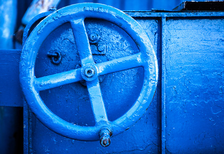 Old blue faucet close-up.