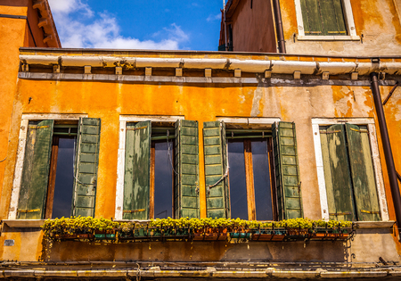 VENICE, ITALY - AUGUST 17, 2016: Famous architectural monuments and colorful facades of old medieval buildings close-up on August 17, 2016 in Venice, Italy.のeditorial素材