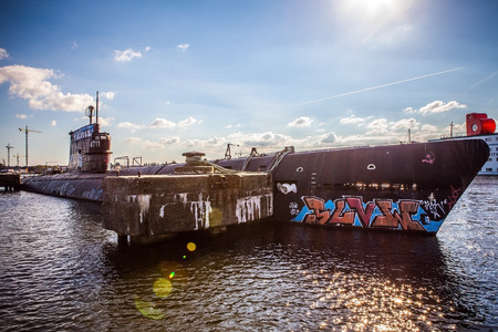 AMSTERDAM - AUGUST 15: Old submarine on NDSM-werf - city-sponsored art community called Kinetisch Noord, center for underground culture in Amsterdam on August 15, 2010 in Amsterdam, Netherlandsのeditorial素材