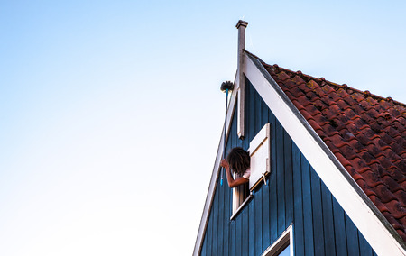 VOLENDAM, NETHERLANDS - JUNE 18, 2014: Traditional houses & streets in Holland town Volendam, Netherlands. Volendam - a small town that has preserved the tradition of Dutch fishing villages.のeditorial素材