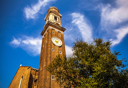 VENICE, ITALY - AUGUST 18, 2016: Famous architectural monuments and colorful facades of old medieval...