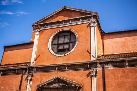 VENICE, ITALY - AUGUST 18, 2016: Famous architectural monuments and colorful facades of old medieval...