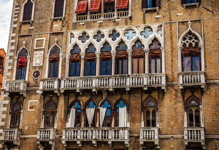 VENICE, ITALY - AUGUST 19, 2016: Famous architectural monuments and colorful facades of old medieval buildings close-up on August 19, 2016 in Venice, Italy.のeditorial素材
