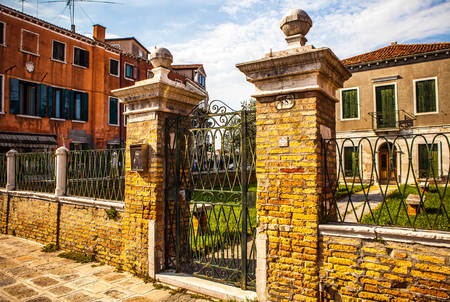 MURANO, ITALY - AUGUST 19, 2016: Famous architectural monuments and colorful facades of old medieval buildings close-up on August 19, 2016 in Murano, Italy.のeditorial素材