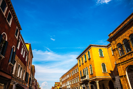 MURANO, ITALY - AUGUST 19, 2016: Famous architectural monuments and colorful facades of old medieval buildings close-up on August 19, 2016 in Murano, Italy.のeditorial素材