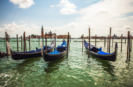 VENICE, ITALY - AUGUST 19, 2016: Traditional gondolas on narrow canal close-up on August 19, 2016 in Venice, Italy.のeditorial素材