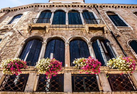 VENICE, ITALY - AUGUST 20, 2016: Famous architectural monuments and colorful facades of old medieval buildings close-up on August 20, 2016 in Venice, Italy.のeditorial素材