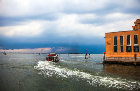 VENICE, ITALY - AUGUST 19, 2016: View on the cityscape of Grand Canal against storm clouds a day before occurred earthquakes in the country on August 19, 2016 in Venice, Italy.のeditorial素材