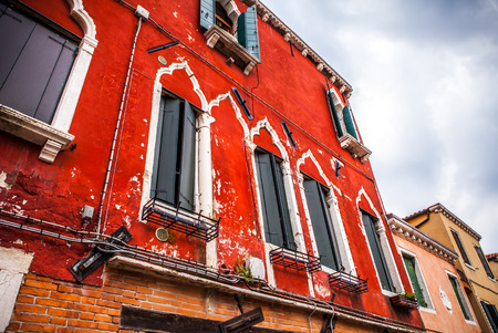 VENICE, ITALY - AUGUST 17, 2016: Famous architectural monuments and colorful facades of old medieval buildings close-up on August 17, 2016 in Venice, Italy.のeditorial素材