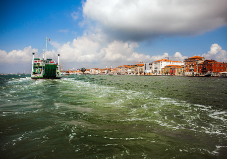 VENICE, ITALY - AUGUST 20, 2016: View on the cityscape of Grand Canal and islands of Venetian lagoon on August 20, 2016 in Venice, Italy.のeditorial素材