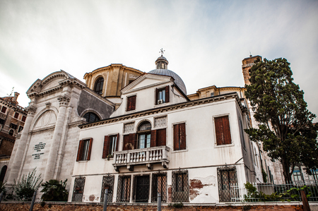 VENICE, ITALY - AUGUST 20, 2016: Famous architectural monuments and colorful facades of old medieval buildings close-up on August 20, 2016 in Venice, Italy.のeditorial素材