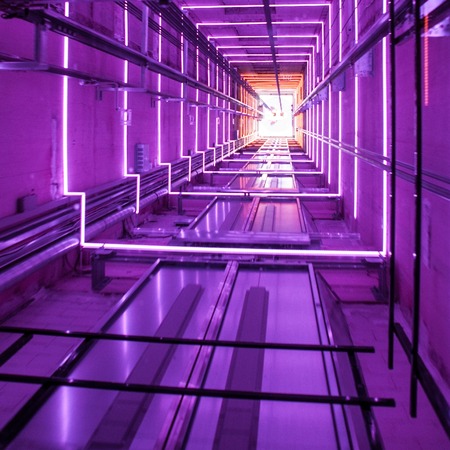 Glass lifts moving up. Close-up abstract photo.の写真素材