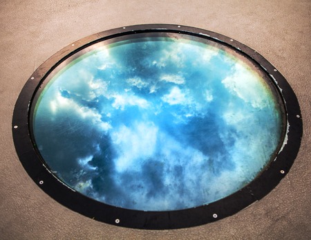Beautiful reflection on round building window. Photo.の写真素材