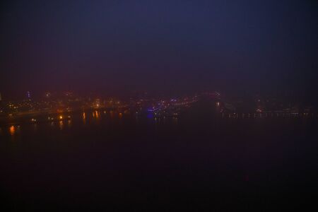 Amsterdam cityscape and beautiful mystic view from top at foggy night.の写真素材