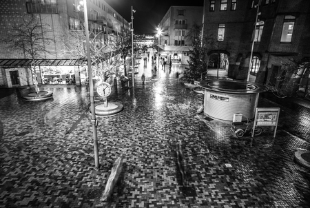 AMSTERDAM, NETHERLANDS - JANUARY 02, 2017: Night streets of Amsterdam with blurred silhouettes of passersby on January 02, 2017 in Amsterdam - Netherland.のeditorial素材