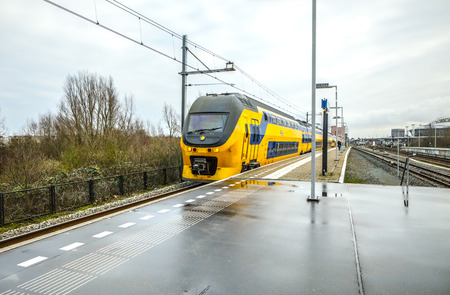 AMSTERDAM, NETHERLANDS - DECEMBER 28, 2016: Railway or railroad tracks for train transportation on...