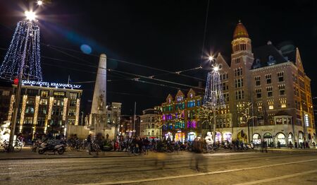 AMSTERDAM, NETHERLANDS - JANUARY 08, 2017: Night streets of Amsterdam with blurred silhouettes of passersby on January 08, 2017 in Amsterdam - Netherland.のeditorial素材