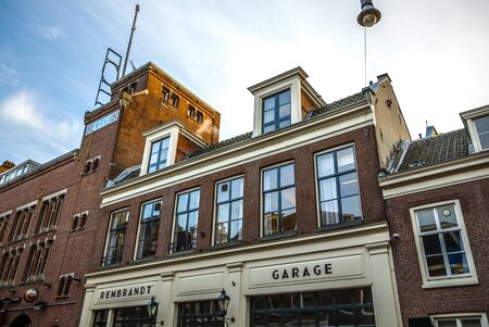 AMSTERDAM, NETHERLANDS - JANUARY 09, 2017: Famous vintage buildings of Amsterdam city at sun set. General landscape view at tradition Dutch architecture. January 09, 2017 - Amsterdam - Netherlands.のeditorial素材
