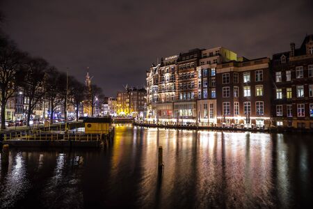 AMSTERDAM, NETHERLANDS - JANUARY 08, 2017: City sights of Amsterdam centre at night. General views of city landscape and architecture. January 08, 2017 in Amsterdam - Netherlands.のeditorial素材