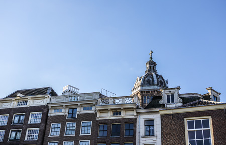 AMSTERDAM, NETHERLANDS - DECEMBER 17, 2017: Famous buildings and place of Amsterdam city centre at...