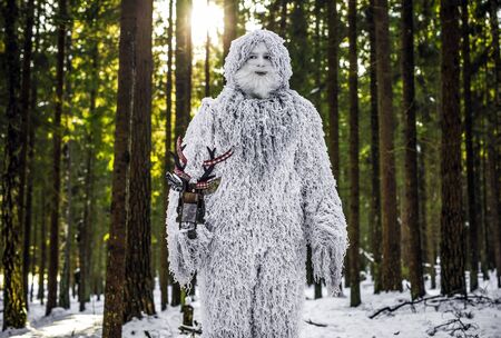 Yeti fairy tale character in winter forest. Outdoor fantasy photo.の写真素材