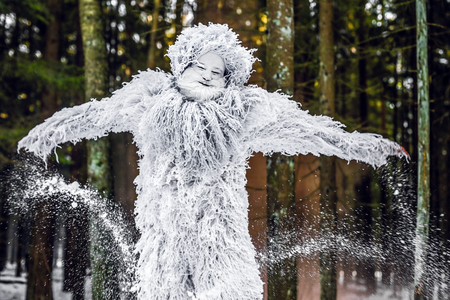 Yeti fairy tale character in winter forest. Outdoor fantasy photo.の写真素材