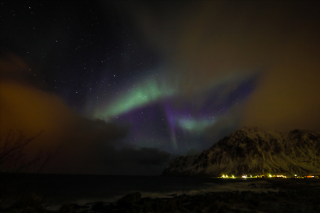 Amazing multicolored Aurora Borealis also know as Northern Lights in the night sky over Lofoten landscape, Norway, Scandinavia.の写真素材