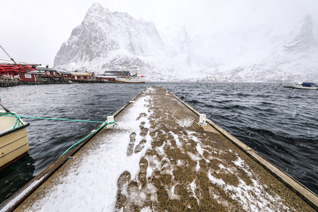 Old pier in traditional fishing settlements of Lofoten islands. Beautiful Norway landscape.の写真素材