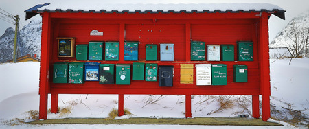 LOFOTEN, NORWAY - MARCH 30, 2017: Traditional mailboxes in the mountain village of Norway on March 30, 2017 in Lofoten Islands - Norway.のeditorial素材