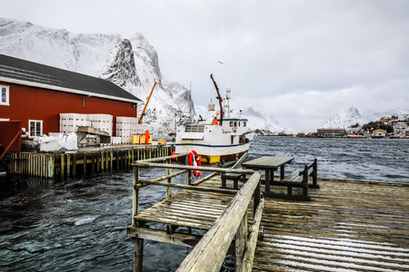 Fishing vessel at the pier of traditional fishing settlements of Lofoten islands. Beautiful Norway landscape.のeditorial素材