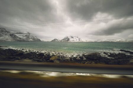 View from the window of a moving car on the Norwegian mountains.の写真素材
