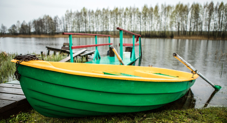 Classic boat with oars on the river.の写真素材