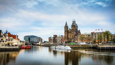 AMSTERDAM, NETHERLANDS - MAY 25, 2017: General view of Central station of Amsterdam city at twilight time. May 25, 2017 in Rotterdam - Netherlands.のeditorial素材
