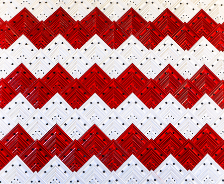 Red-white texture of wooden antic door close-up as background.の写真素材