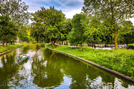 The most famous canals and embankments of Utrecht city during sunset. General view of the cityscape and traditional Netherlands architecture.のeditorial素材