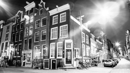 AMSTERDAM, NETHERLANDS - MAY 28, 2017: General view of famous places in Amsterdam city at night time. Black-white photo. May 28, 2017 in Amsterdam - Netherlands.のeditorial素材
