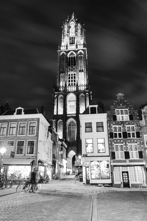 Ancient European church close-up at night black-white photo. Utrecht - Holland.のeditorial素材