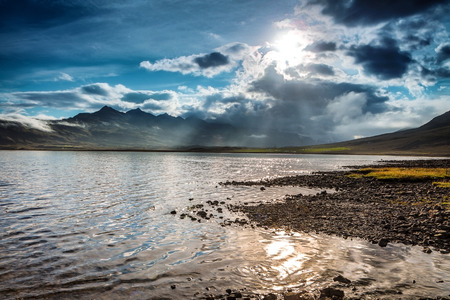 Picturesque landscape of a mountain river with traditional nature of Iceland at amazing sun set.の写真素材