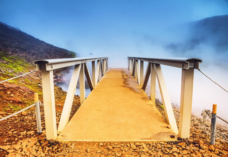 Bridge and picturesque Icelandic landscape.の写真素材