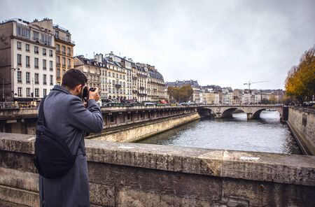 Tourist taking pictures of the central sights of Paris.の写真素材