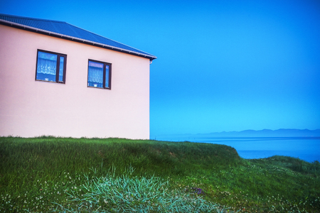 Traditional Icelandic village with houses and beautiful morning landscape.の写真素材