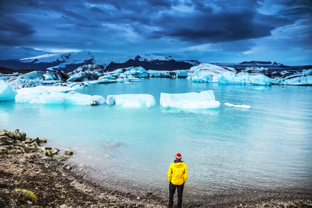 Traveler against  picturesque Icelandic landscape.の写真素材