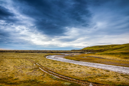 Picturesque landscape of a mountain river with traditional nature of Iceland.の写真素材