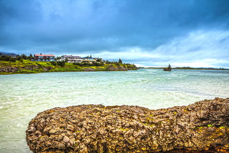 Traditional Icelandic village with houses and beautiful morning landscape.の写真素材